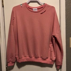 Ripped pink sweater